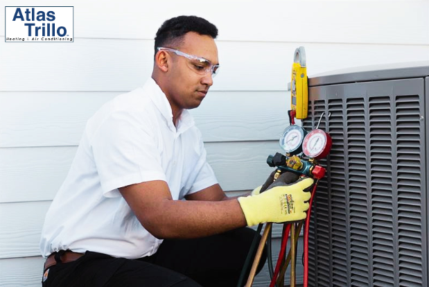 Atlas Trillo contractor testing a newly installed air conditioning unit outside a home in San Jose, CA.